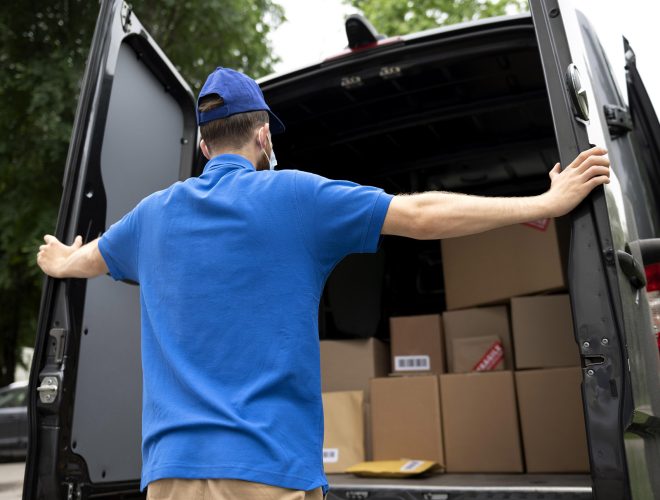 medium-shot-delivery-man-looking-boxes.jpg